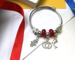 Elegant Silver Charm Bracelet with Red Beads