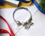 Ivory Grace Charm Bracelet – Butterfly, Love & Elephant Charms - Image 4