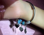 Silver-Toned Ocean-Inspired Charm Bangle Bracelet with Blue Murano Bead, Heart, Feather & Cowrie Shell Dangles - Image 3