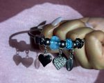 Silver-Toned Ocean-Inspired Charm Bangle Bracelet with Blue Murano Bead, Heart, Feather & Cowrie Shell Dangles - Image 4