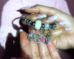 Chic Silver-Toned Statement Charm Bangle Bracelet with Love Pendant, Elephant, Shell, and Pearl-Inspired Accents for Modern Ethnic Style - Image 2