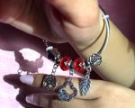 Bold Silver-Toned Open Cuff Charm Bracelet with Red Crystal Beads, Girl Motif, Clover Heart Frame & Hamsa Hand Protection Symbol - Image 5