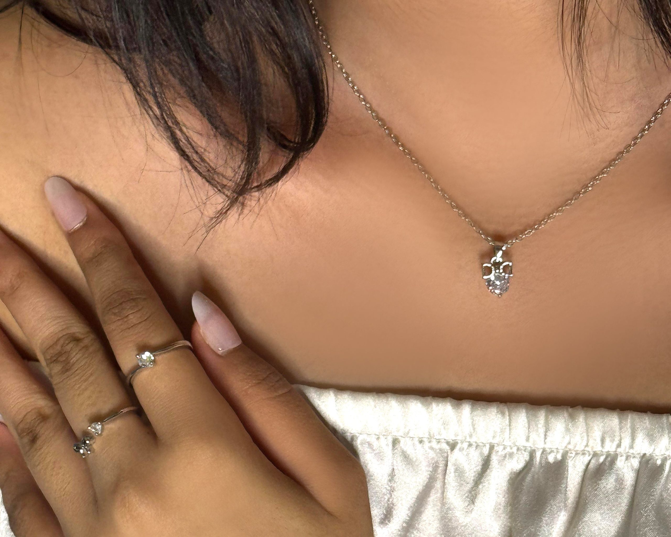 WhatsApp_Image_2025-06-15_at_9.38.49_PM.jpg Dainty Bow & Crystal Pendant Necklace – Silver-Tone Charm Chain - Image 1