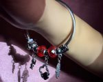 Bold Silver-Toned Open Cuff Charm Bracelet with Red Crystal Beads, Girl Motif, Clover Heart Frame & Hamsa Hand Protection Symbol - Image 2